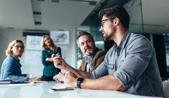 Office Workers In A Modern Workplace